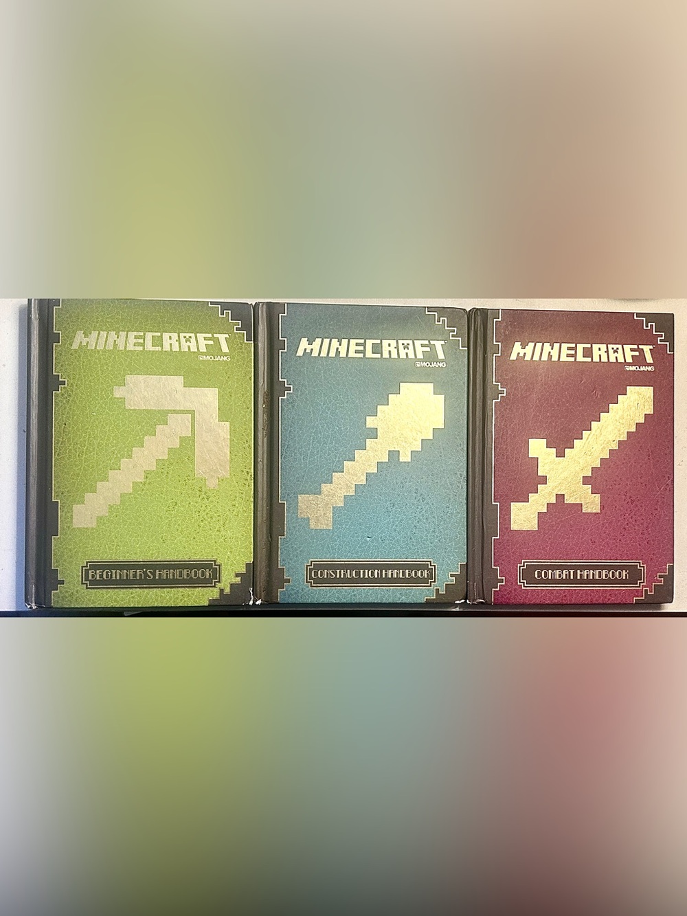 3 Minecraft Hardcover Books: Beginner’s, Combat, and Construction Game Handbooks